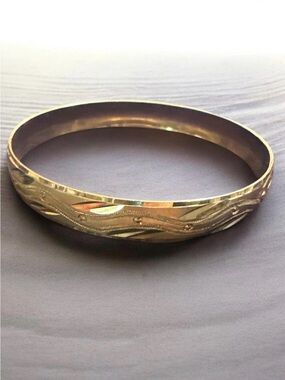 Gold Tone Engraved Bangle Bracelet
908